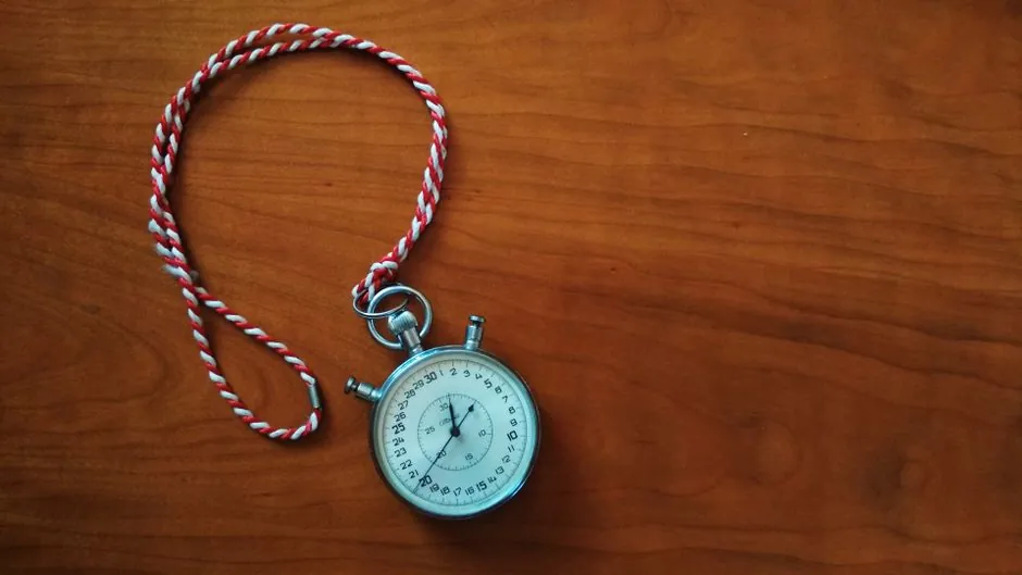 Stopwatch on a desk representing test turnaround time