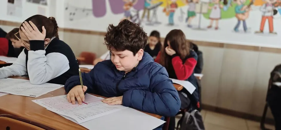 Students taking a placement test in a classroom