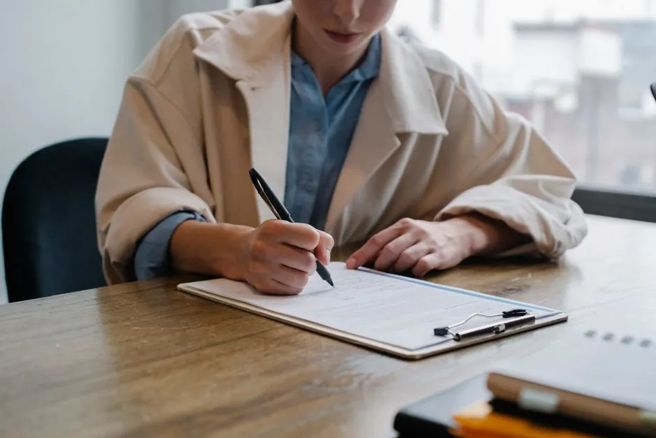Admissions officer sorting application documents