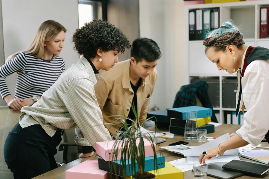 Small growing company team collaborating in an office